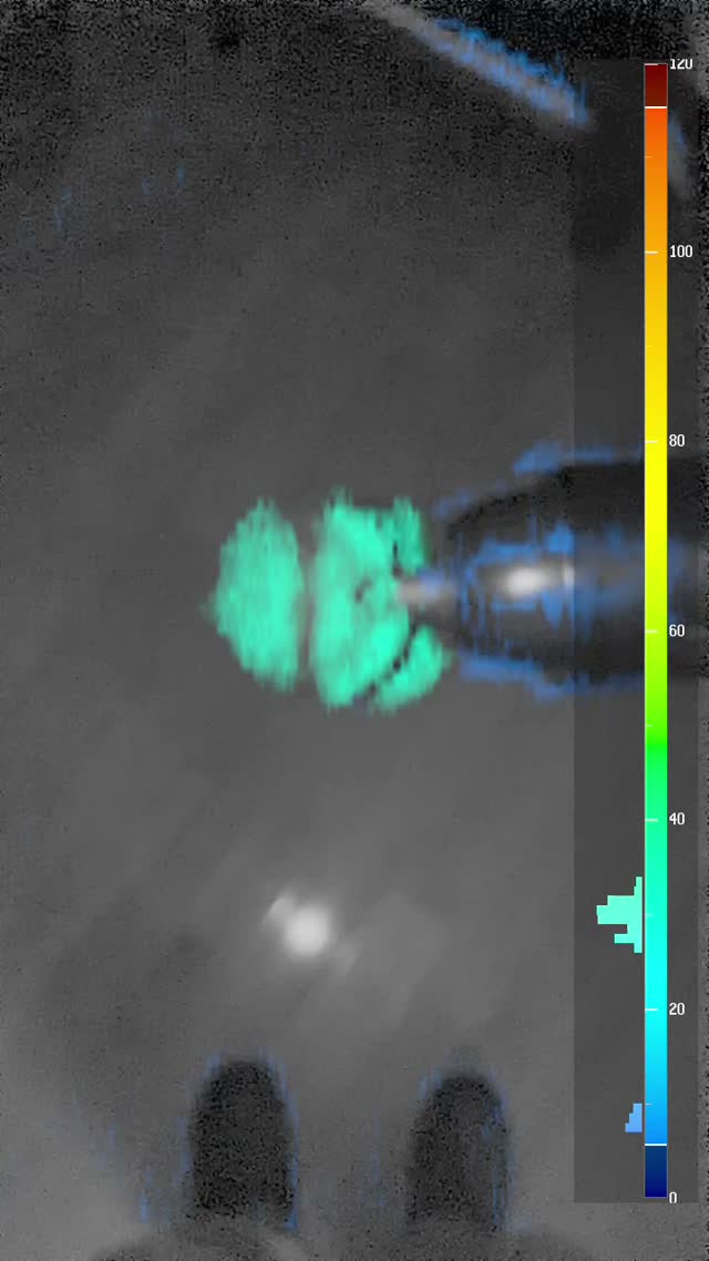 VibraLens in a dim shop: cyan vibration overlay on a running power tool against the 0–120 Hz legend